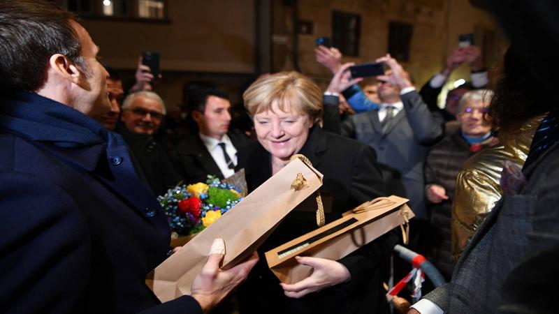 Macron Bids Farewell to Merkel: France Loves You