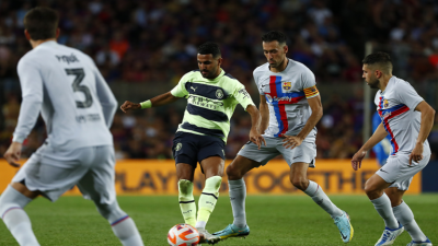 Manchester City Draws with Barcelona in High-Scoring Match