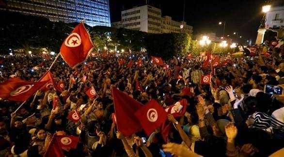 Supporters of the Tunisian President Celebrate Government Dismissal with Cheers and Fireworks