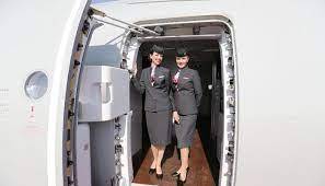 Why Flight Attendants Keep Their Hands Behind Their Backs