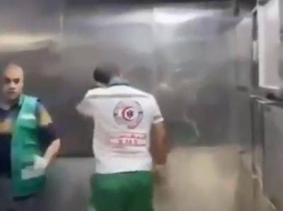 Title: Video Captures Paramedic's Hysterical Crying After Seeing Victims' Remains from Israeli Shelling