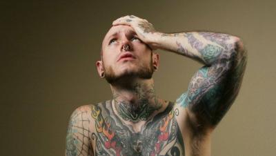 Tattoo Artists Face Serious Risks of Neck and Back Injuries