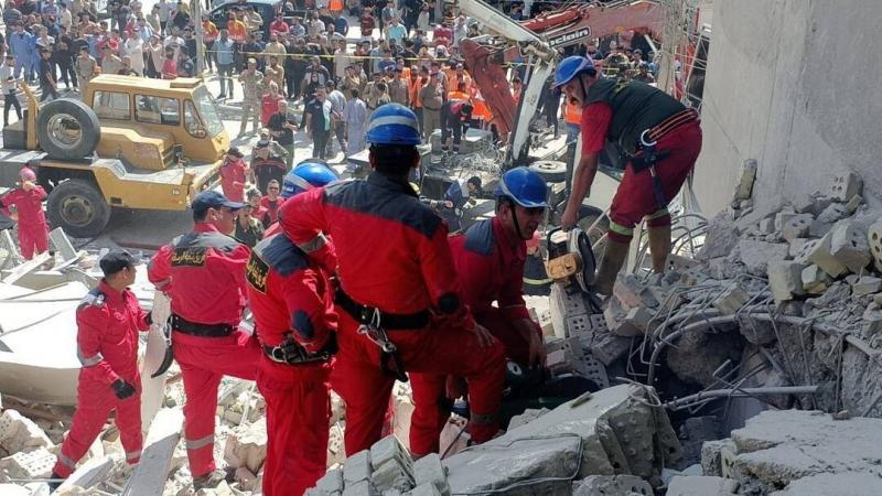 Recovery of the Body of a Girl and Her Mother from the Rubble of the Collapsed Karada Building