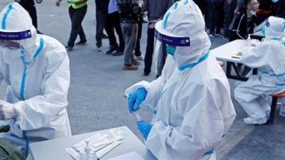 Title: China Reports Record Surge in COVID-19 Cases