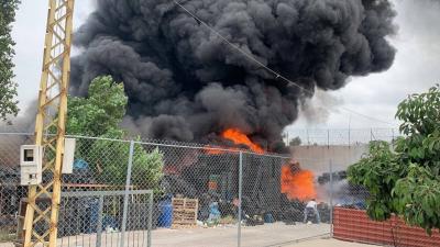 Title: Extinguishing a Large Fire in a Warehouse at the Western Entrance of Ain al-Hilweh Camp