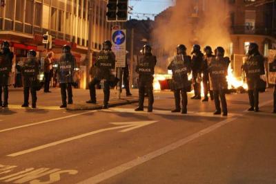 Title: Riots Spread from France to Switzerland