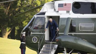 Title: Biden Bumps Head on Helicopter Door After Falling on Stage