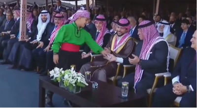 Child Presents "Paper" to the Jordanian King at the Celebration