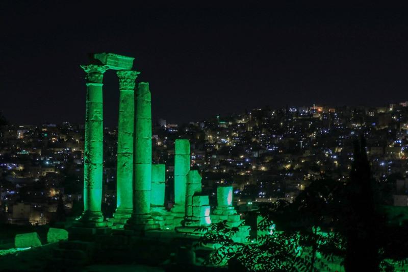 Colors of the Saudi Flag Illuminate the Citadel Mountain in Jordan