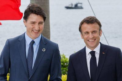 Title: Canadian Prime Minister Discusses Various Issues with Macron