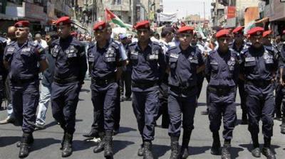 Title: Jordanian Police Clash with Protesters Near Israeli Embassy