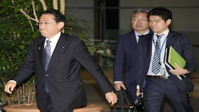 Title: Japanese Prime Minister Dismisses His Son from Position Due to Inappropriate Photo