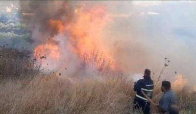 Fire at the Wall of Kharaib Town and Efforts to Extinguish It