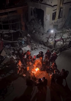 Title: Gaza Residents by the Ruins of Their Homes in 
