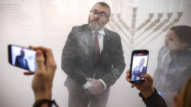 Title: Polish Lawmaker Extinguishes Hanukkah Candles with Fire Extinguisher (Video)