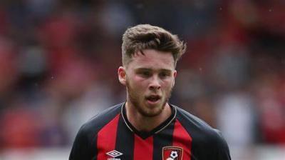 Title: Former Cardiff Player Simpson Banned for Racial Conduct