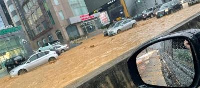 Title: Minister Warns: Flood Scene on the Highway May Recur