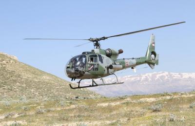 Title: Army Helicopters Monitor Qornet El Sawda