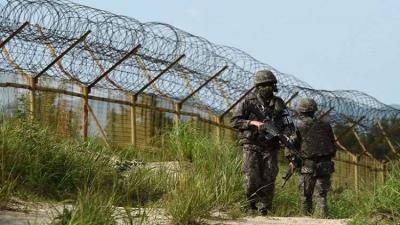 Title: North Korea Deploys Troops and Weapons Near the Border After Suspending Military Treaty