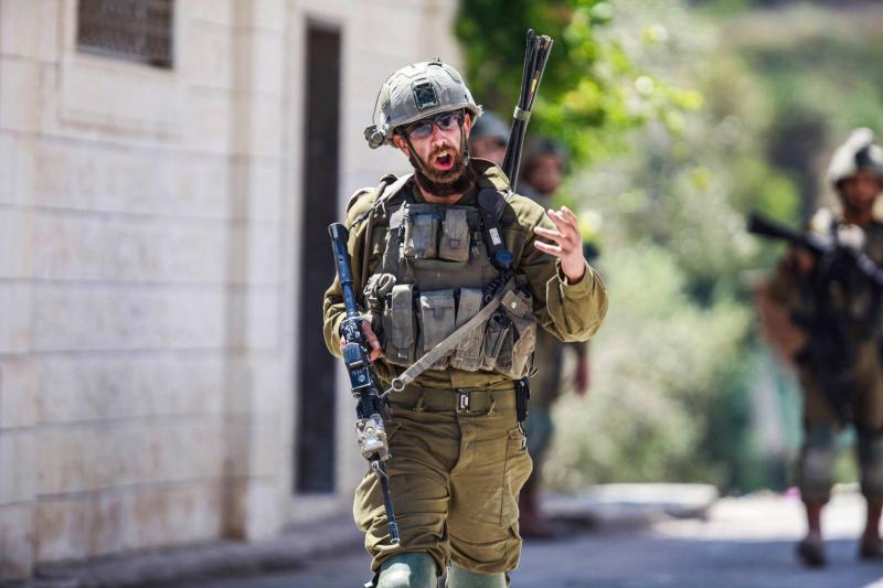 Title: Israeli Forces Kill Two Palestinians in the West Bank