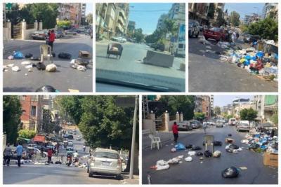 Title: Residents Block Al-Hilaliya Main Road with Waste