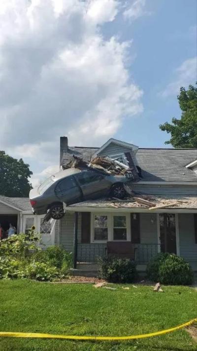 Car Flies into the Air and Gets Stuck on the Second Floor of an American Home