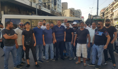 Title: Bus Drivers in Tripoli Protest Against Unlicensed Syrian Drivers