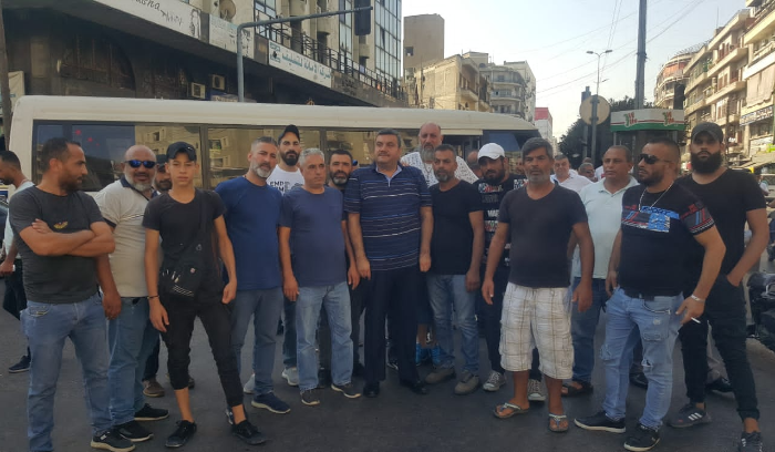 Title: Bus Drivers in Tripoli Protest Against Unlicensed Syrian Drivers