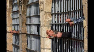 Title: Guards Extinguish Fire Set by Inmates in Prison Wing Near Tehran