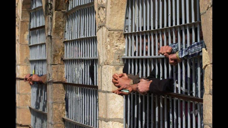 Title: Guards Extinguish Fire Set by Inmates in Prison Wing Near Tehran