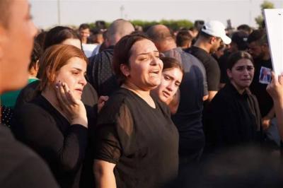 Title: Iraq: Mourners Bury Their Victims and Demand Accountability After Wedding Fire