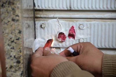 Closure of Supermarket in Ain al-Dalab with Red Wax
