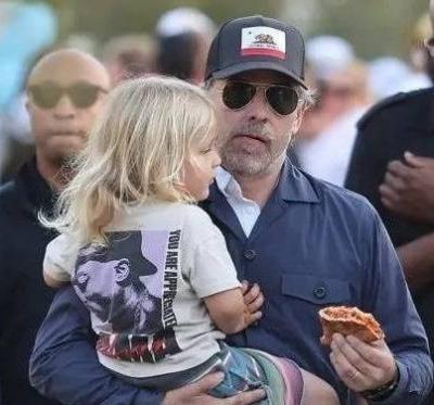 Hunter Biden and His Family in a Long Line for Free Pizza