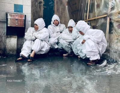 Children of Gaza in Corona Clothes to Protect Against Cold