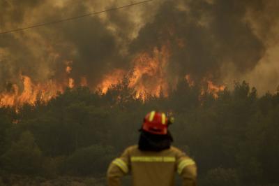 Title: Wildfires Continue in Greece for the Third Day