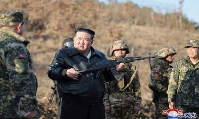 North Korean Leader Inspects Military Training Base with a Rifle