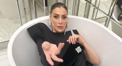Ghada Abdel Razek in the Bathtub in a Evening Dress