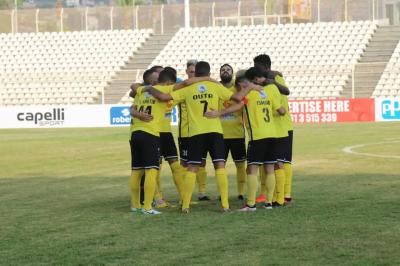 Title: "Al-Ahed Defeats Al-Burj in Football Championship"