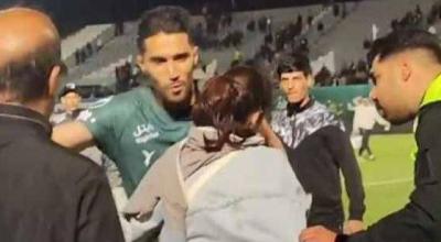 Police Attacks Iranian Goalkeeper on the Field Over Hug
