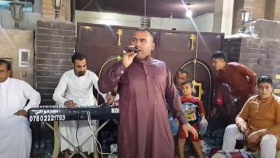 Injury of Iraqi Folk Singer by Stray Bullet During Wedding Celebration
