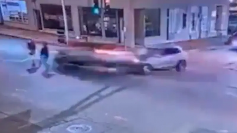 Title: Video of Reckless Driver Running Red Light and Hitting Woman and Her Daughter