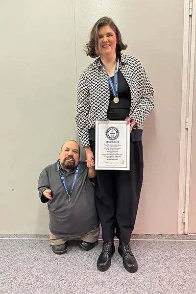 Title: Couple Enters Guinness World Records Due to Height Difference
