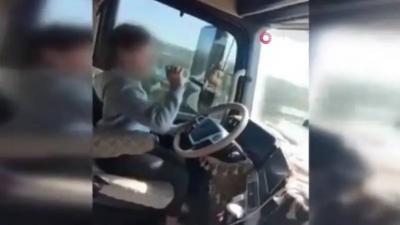 In Turkey: A Girl Drives a Truck with One Hand While Drinking Water with the Other