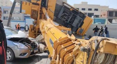 Title: Crane Collapse in Egypt Shatters Two Cars