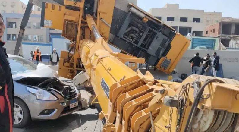 Title: Crane Collapse in Egypt Shatters Two Cars