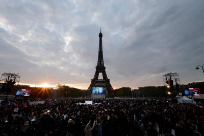 Protesters near the Eiffel Tower against the new French immigration law