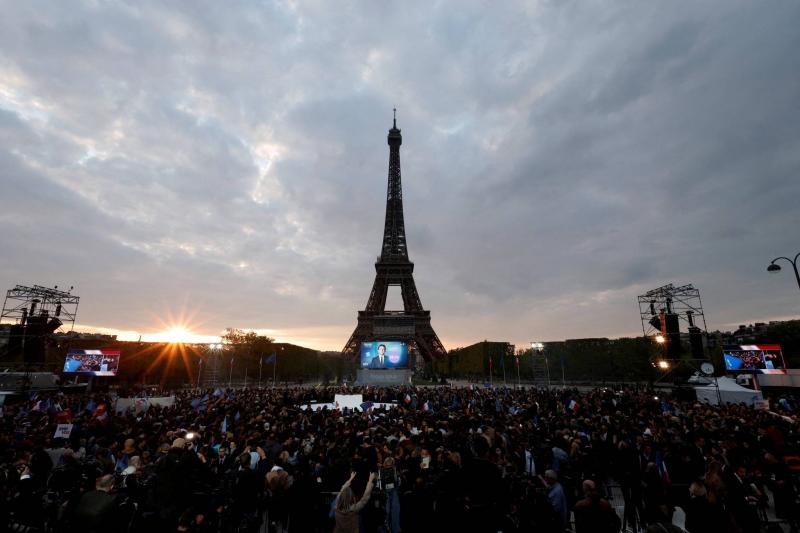 Protesters near the Eiffel Tower against the new French immigration law