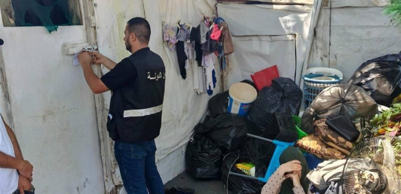 Title: Security Forces Evacuate Town of Displaced Persons
