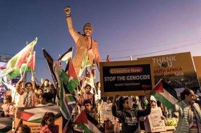 South African Minister: Mandela Smiles in His Grave