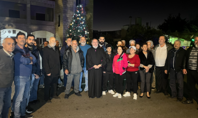 Illma al-Shaab Lights Christmas Tree and Media Minister Commemorates the Courage of the Residents